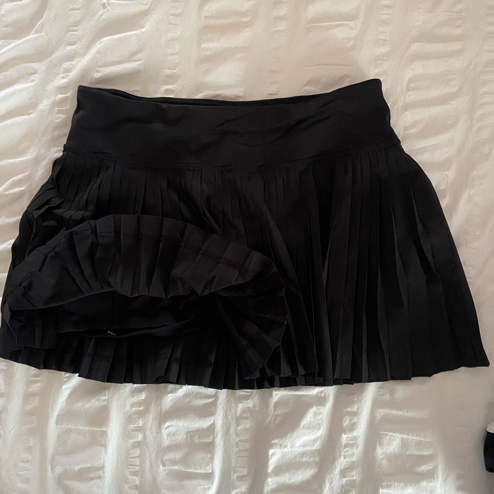 Lululemon black pleated skort with zipper pocket in back